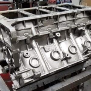 Engine block on a workshop table.